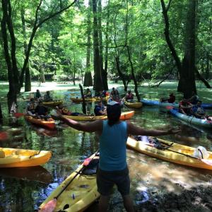 Tour guide talking to kayakers