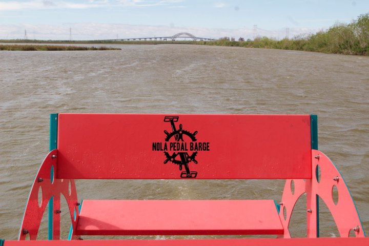 a wooden bench sitting next to a body of water