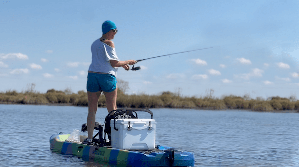 louisiana kayak fishing a person riding on the back of a boat in a body of water
